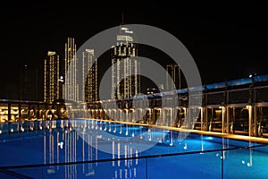 Skyline with swimming pool with reflexion in front
