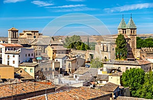 Skyline of Toledo with Santiago del Arrabal Church and Puerta de Bisagra Nueva Gate. Spain photo