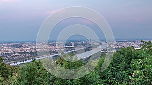 Skyline of Vienna from Danube Viewpoint Leopoldsberg aerial day to night timelapse.