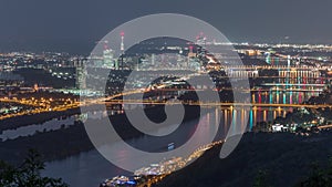 Skyline of Vienna from Danube Viewpoint Leopoldsberg aerial night timelapse.