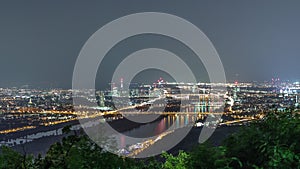 Skyline of Vienna from Danube Viewpoint Leopoldsberg aerial night timelapse.