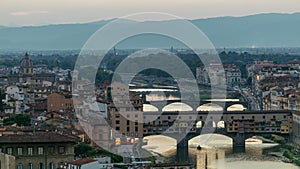 Skyline view of Arno River day to night timelapse, Ponte Vecchio from Piazzale Michelangelo at Sunset, Florence, Italy.