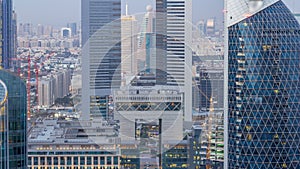 Skyline view of the buildings of Sheikh Zayed Road and DIFC day to night timelapse in Dubai, UAE.