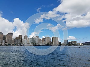 Skyline of Waikiki and Diamond Head during day with yachts and b