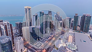 The skyline of the West Bay area from top in Doha day to night timelapse, Qatar.