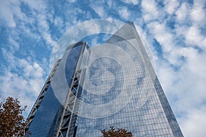 The skyline in world trade center, modern building with glass wall under the blue sky