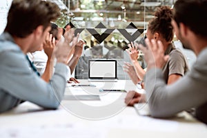 Skype call. Group of business people having video conference while sitting in meeting room. Business team looking at the photo