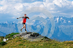 Skyrunning athlete in training on mountain ridges