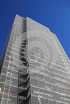 skyscraper with apartments and offices during the installation of the external thermal coat photo