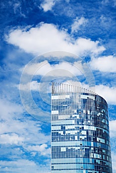 Skyscraper, blue sky with clouds. City, building