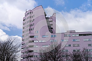 Skyscraper with blue sky and trees