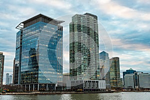 Skyscraper at city waterfront. Urban skyline with building. Architecture on cityscape view. Modern architecture