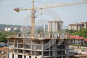 Skyscraper construction with crane and formworks photo