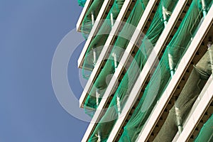 Skyscraper construction site with blue clear sky copy space background