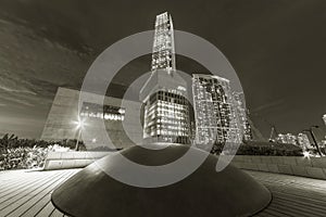 Skyscraper in downtown district of Hong Kong city at night in black and white