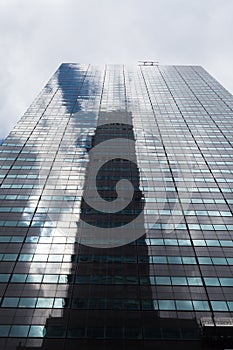 Skyscraper low angle view with reflections, New York City