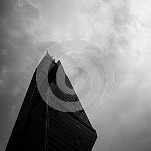 Skyscraper with a modern, angular design, featuring sharp, geometric lines and a