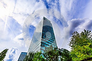 Skyscraper. Modern office building exterior design, glass facade. Urban view at summer. World Trade Center, Amsterdam, Netherlands