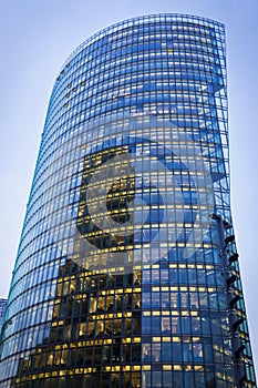 Skyscraper with office windows and glass background