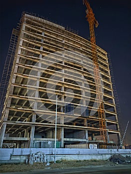 Skyscraper under construction view at night