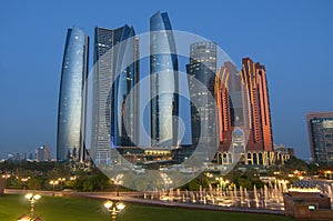 Skyscrapers of Abu Dhabi at night with Etihad Towers buildings. Abu Dhabi is the capital and the second most populous city of the