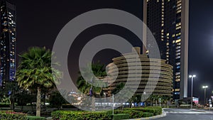 Skyscrapers of Abu Dhabi at night with Etihad Towers buildings timelapse.