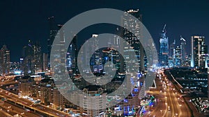 Skyscrapers aerial view in downtown and financial district Dubai at night, United Arab Emirates