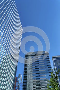 Skyscrapers apartments exterior view with cloudless blue sky background