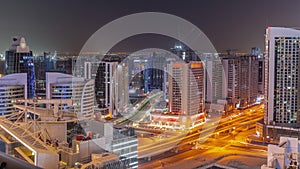 Skyscrapers at the Business Bay in Dubai aerial day to night timelapse, United Arab Emirates