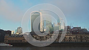Skyscrapers in City of London in mist in the business area showing Walkie Talkie building and other