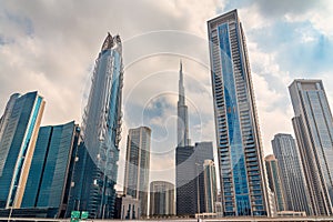 Skyscrapers in Dubai downtown, modern urban architecture. High-rise glass buildings, United Arab Emirates