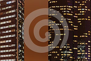 Skyscrapers with illuminated windows at night