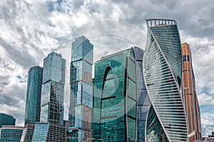 Skyscrapers of the Moscow City business center against a cloudy sky