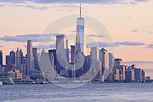 The skyscrapers of New York City view from water after the sunset, USA