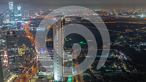 Skyscrapers and other buildings near the Dubai World Trade center district in Dubai aerial night timelapse