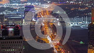 Skyscrapers and other buildings near the Dubai World Trade center district in Dubai aerial night timelapse