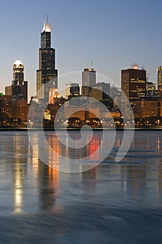 Skyscrapers reflected in icy Lake Michigan