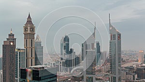 Skyscrapers on Sheikh Zayed Road and DIFC day to night timelapse in Dubai, UAE.