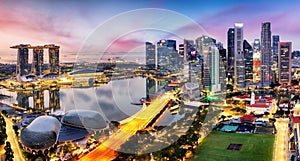 Skyscrapers of Singapore skyline at the beautiful sunset, aerial panorama