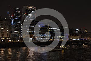 Skyscrapes of financial district at night in London, England UK