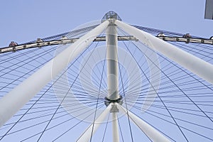 Skyward view of a towering Ferris wheel showcasing its engineering and symmetry