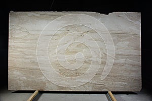 A slab of natural stone beige marble with a beautiful pattern, called Bressia Sarda