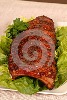 Slab of ribs on lettuce