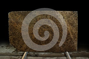 A slab with a texture of natural brown marble called Emperador Dark photo