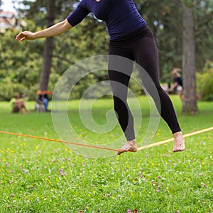 Slack line in the city park.