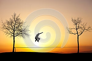Slackliner in sunset