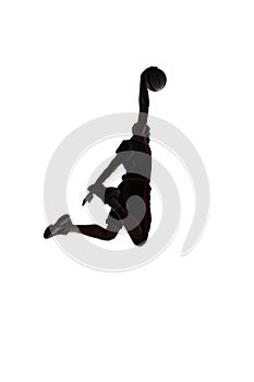 Slam dunk. Back view silhouette of young man, basketball player in motion throwing ball during game isolated on white