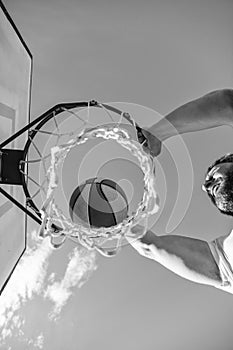 slam dunk in motion. top view. summer activity. man with basketball ball on court.