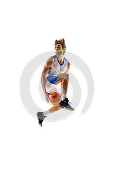 Slam dunk. Young, focused man, basketball player in motion, leaps a dunk, training isolated on white background