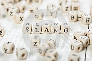 Slang word written on wood block.